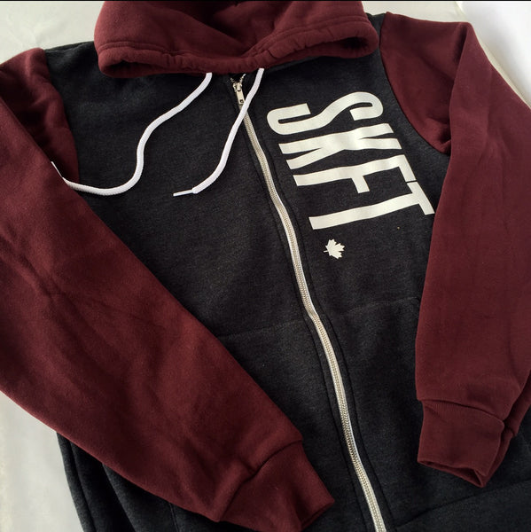 Unisex Grey and Burgundy super soft zip up hoodie with white SKFT on the top left chest area  with the maple leaf